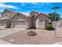 Well-maintained single-story home with a two-car garage, xeriscape front yard, and desert landscaping at 254 W Amoroso Dr, Gilbert, AZ 85233