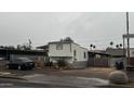 Charming home with neutral siding, gravel landscaping, and convenient covered parking at 2721 E Beverly Ln, Phoenix, AZ 85032