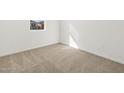View of a bedroom with neutral carpet and a view of a window at 335 S San Gregorio Ln, Casa Grande, AZ 85194