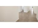 View of the hallway featuring light grey tile and white walls at 335 S San Gregorio Ln, Casa Grande, AZ 85194