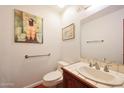 Bathroom with unique art, a tiled countertop and wood floors at 3417 E Mission E Ln, Phoenix, AZ 85028