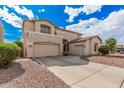 Spacious home features a three-car garage and desert landscaping at 3680 S Tower Ave, Chandler, AZ 85286