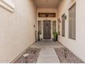Inviting front porch with decorative plants, wreath, and exterior lights at 3680 S Tower Ave, Chandler, AZ 85286