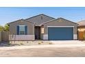 Well-maintained single-story home with desert landscaping and a two-car garage at 37357 W San Sisto Ave, Maricopa, AZ 85138