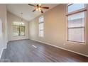 Spacious living room with high vaulted ceilings and updated wood-look flooring at 3765 E Oxford Ln, Gilbert, AZ 85295