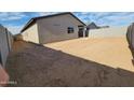 Large, blank-slate backyard, perfect for customization, enclosed by a sturdy block fence at 4226 W Lisa Ln, San Tan Valley, AZ 85144