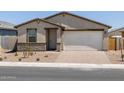Inviting single-story home with a brick driveway, two-car garage, and desert landscaping at 4226 W Lisa Ln, San Tan Valley, AZ 85144