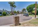 Neighborhood street view showcasing well-maintained homes, mature trees, and a mountain in the background at 5307 N 32Nd Pl, Phoenix, AZ 85018