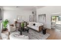 Cozy living room featuring modern decor, stylish furnishings, and plenty of natural light at 5909 E Crocus Dr, Scottsdale, AZ 85254