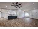 Open living space featuring wood floors and contemporary lighting at 619 N Norfolk --, Mesa, AZ 85205