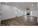 Bright open-concept living room, fireplace, and wood-look floors at 619 N Norfolk --, Mesa, AZ 85205