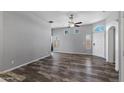 Spacious living room featuring wood-look floors, neutral walls, and lots of natural light at 6610 E University Dr # 165, Mesa, AZ 85205
