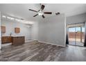 Bright living room showcases wood-look flooring and a slider to the exterior at 6610 E University Dr # 165, Mesa, AZ 85205