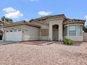 Inviting single-story home with a desert-style front yard and a spacious two-car garage at 6752 W Citrus Way, Glendale, AZ 85303