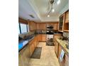 A gourmet kitchen featuring granite countertops, stainless steel appliances, and wood cabinets at 7432 E Hum Rd # 203, Carefree, AZ 85377