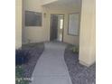 Inviting condo entrance with open door and neutral tones, creating a welcoming and bright arrival at 7575 E Indian Bend Rd # 1100, Scottsdale, AZ 85250