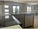 Kitchen with white countertops, stainless steel appliances, modern fixtures and updated cabinetry at 954 E Henry St, Tempe, AZ 85288