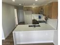 Bright kitchen featuring an island, white countertops, updated cabinets and stainless steel appliances at 954 E Henry St, Tempe, AZ 85288