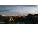 Expansive city views from the elevated lot, showcasing the illuminated skyline at night at 10040 E Happy Valley Rd # 1011, Scottsdale, AZ 85255