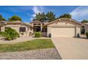 Charming single-story home with desert landscaping, lush greenery, and a two-car garage at 13731 W Greenview Dr, Sun City West, AZ 85375