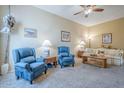 Comfortable living room featuring neutral walls, plush carpeting, and traditional furnishings at 14080 N Newcastle Dr, Sun City, AZ 85351
