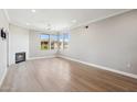 Bright living room with a corner fireplace and large windows offering neighborhood views at 19777 N 76Th St # 3220, Scottsdale, AZ 85255