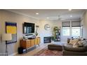 Stylish living room featuring modern decor, a cozy fireplace, and comfortable seating at 19777 N 76Th St # 3220, Scottsdale, AZ 85255