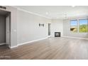 Spacious living room with fireplace, light wood floors and lots of natural light at 19777 N 76Th St # 3220, Scottsdale, AZ 85255