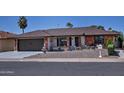 A charming single-story brick home with a well-manicured desert landscape at 228 N 65Th Pl, Mesa, AZ 85205