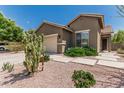 Charming single-story home featuring a two-car garage, secure door, and desert landscaping at 3349 E Merlot St, Gilbert, AZ 85298