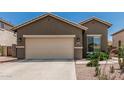 Charming single-story home featuring a two-car garage with desert landscaping in a sunny neighborhood at 3349 E Merlot St, Gilbert, AZ 85298