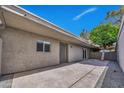 Spacious back patio perfect for outdoor entertaining and relaxation, with a low maintenance landscape at 5025 W New World Dr, Glendale, AZ 85302