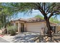 Charming home featuring a well-maintained front yard and a two-car garage at 7500 E Deer Valley Rd # 132, Scottsdale, AZ 85255