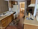 Well-lit kitchen featuring ample counter space and an adjacent dining area for convenient meals at 973 Leisure World --, Mesa, AZ 85206