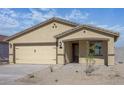 Inviting single-story home features a well-maintained front yard and a two-car garage at 1131 W West Virginia Ave, Florence, AZ 85132