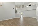 Spacious living room with wood-style tile flooring, a high ceiling and lots of natural light at 1741 S Clearview Ave # 74, Mesa, AZ 85209