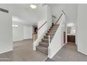 Bright and airy foyer featuring a staircase, tile flooring, and access to other living spaces at 1811 S 39Th St # 30, Mesa, AZ 85206