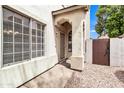 Welcoming front entrance featuring an arched entryway, security door, and stylish window details at 1811 S 39Th St # 30, Mesa, AZ 85206