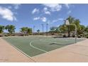 Outdoor basketball court with well-maintained surface and hoops, great for recreation and exercise at 18540 N Foxtail Dr, Maricopa, AZ 85138