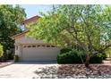Charming two-story home featuring a neutral color scheme, well-manicured landscaping, and a spacious two-car garage at 21614 N 59Th Ln, Glendale, AZ 85308