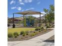 Gathering-friendly playground with a covered play structure and picnic area at 2735 W La Mirada Dr, Laveen, AZ 85339