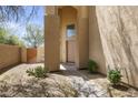 Inviting front entrance showcasing a decorative cactus and shaded walkway with an archway entry at 5133 E Juana Ct, Cave Creek, AZ 85331