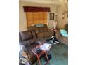 Cozy living room featuring comfortable seating and a warm, inviting atmosphere at 8022 E 1St Ave, Mesa, AZ 85208