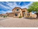 Beautiful two-story home showcasing well-manicured landscaping and an attached two-car garage at 10308 E Osage Ave, Mesa, AZ 85212