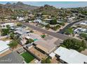 Scenic aerial view of a residential neighborhood with mountain views and well-maintained homes at 1320 E Butler Dr, Phoenix, AZ 85020