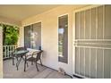 Cozy covered porch with seating area, perfect for enjoying the outdoors at 14298 W Amelia Ave, Goodyear, AZ 85395