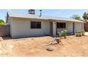 Cozy single-story home with a light gray paint and neat landscaping at 18427 N 32Nd Ln, Phoenix, AZ 85053