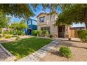 Charming home with a green lawn and a well-maintained landscape in a residential area at 3443 E Jasper Dr, Gilbert, AZ 85296