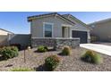 Inviting single-Gathering home with desert landscaping, gravel yard, and a two-car garage at 3914 E French Trotter St, San Tan Valley, AZ 85140
