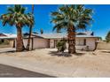 Single-story home with a two-car garage and desert landscaping at 4702 W Northview Ave, Glendale, AZ 85301
